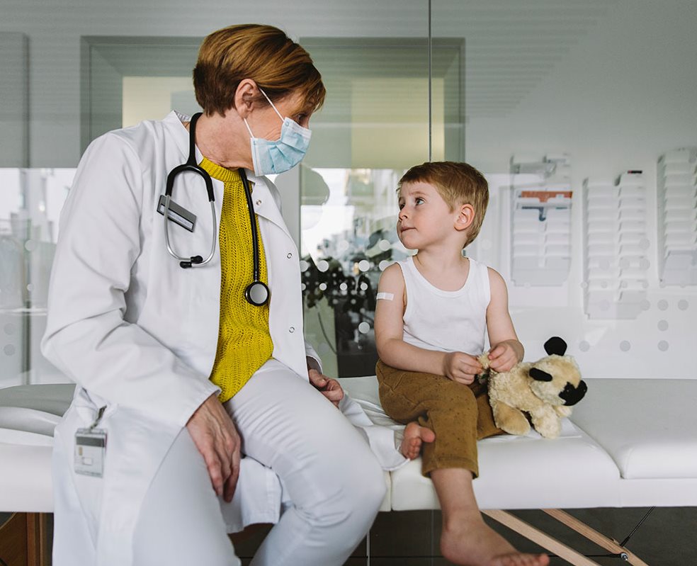 young patient at a check up with his doctor